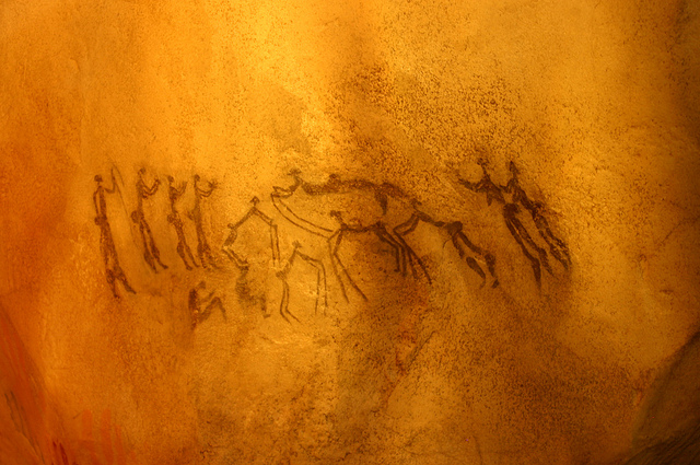 Image by Ryan Somma via Flickr (CC BY-SA 2.0). Cave painting, dance scene. Taken at the David H. Koch Hall of Human Origins at the Smithsonian Natural History Museum.